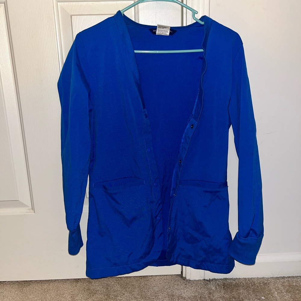 BRAND NEW royal blue scrub jacket. Size small.